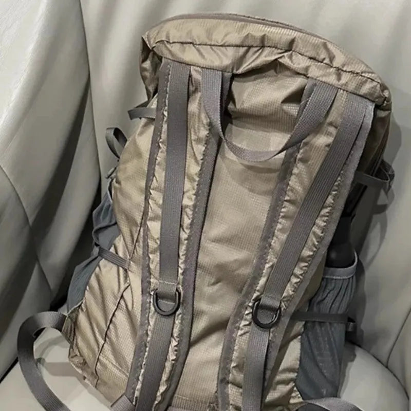Lightweight waterproof nylon backpack 20-35L in natural Renaissance khaki light with curved shoulder straps and contrast colour detail