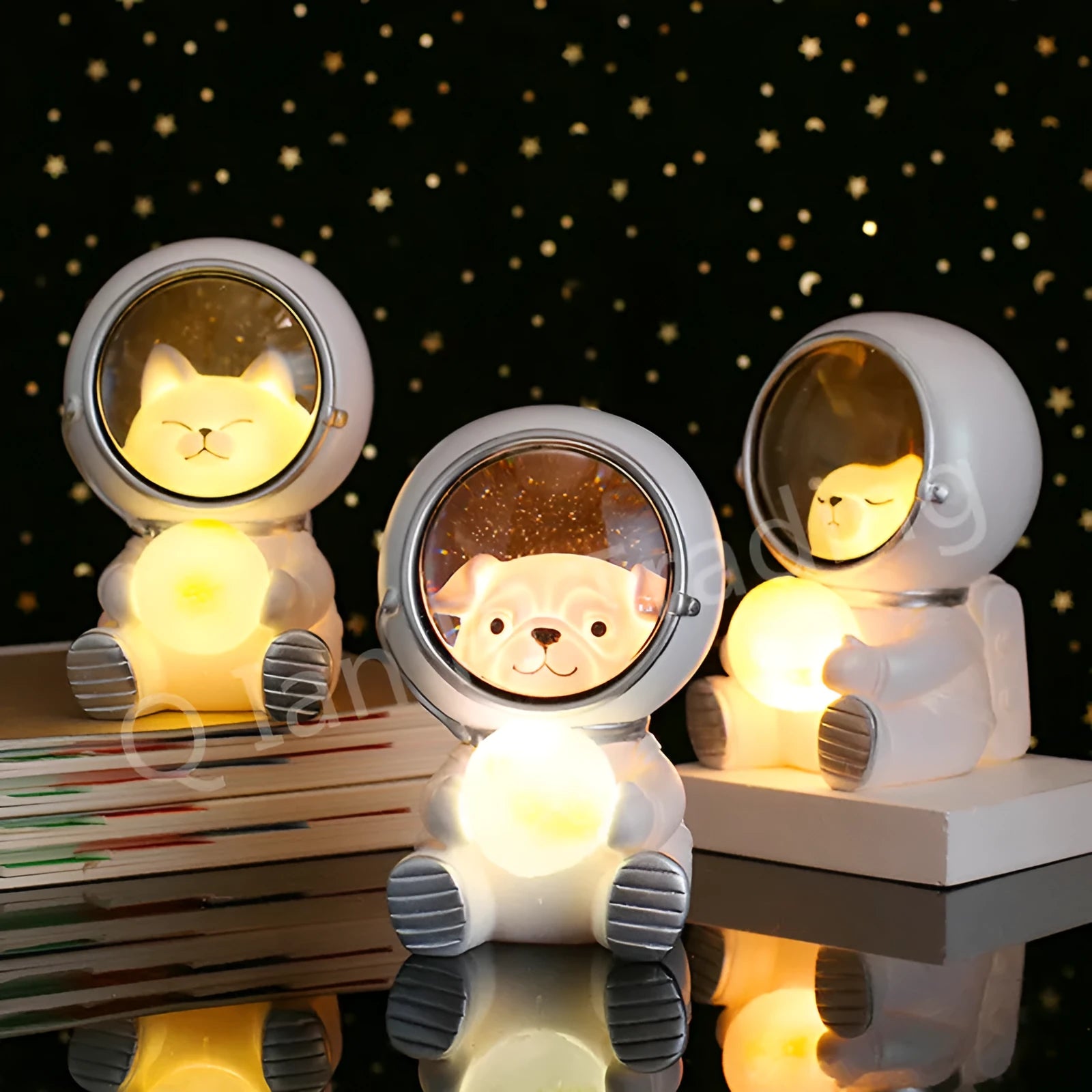 Resin bear-shaped starry sky night light with soft LED glow on a wooden table.