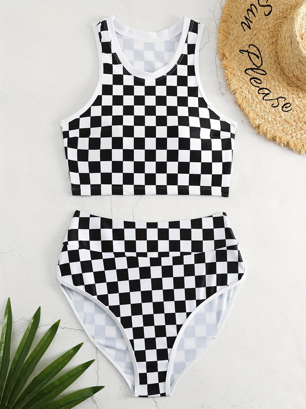 Adult female backless racing swimsuit with suspender straps in checkerboard print pattern
