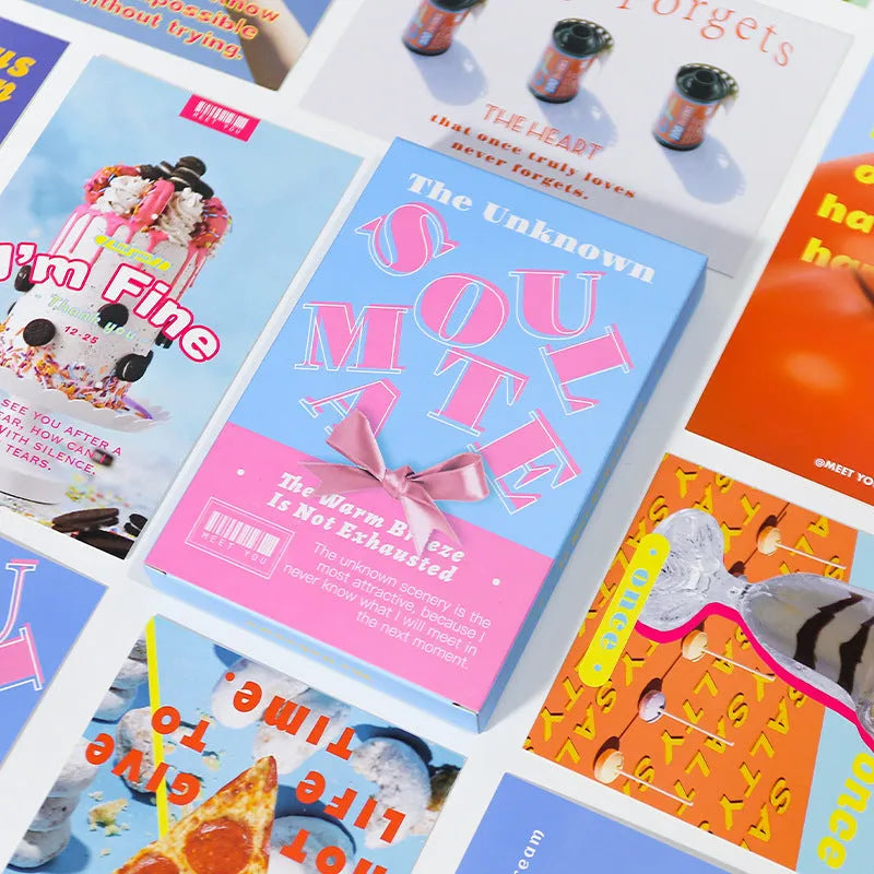 Box of fresh printed postcards showing two creative greeting card designs.