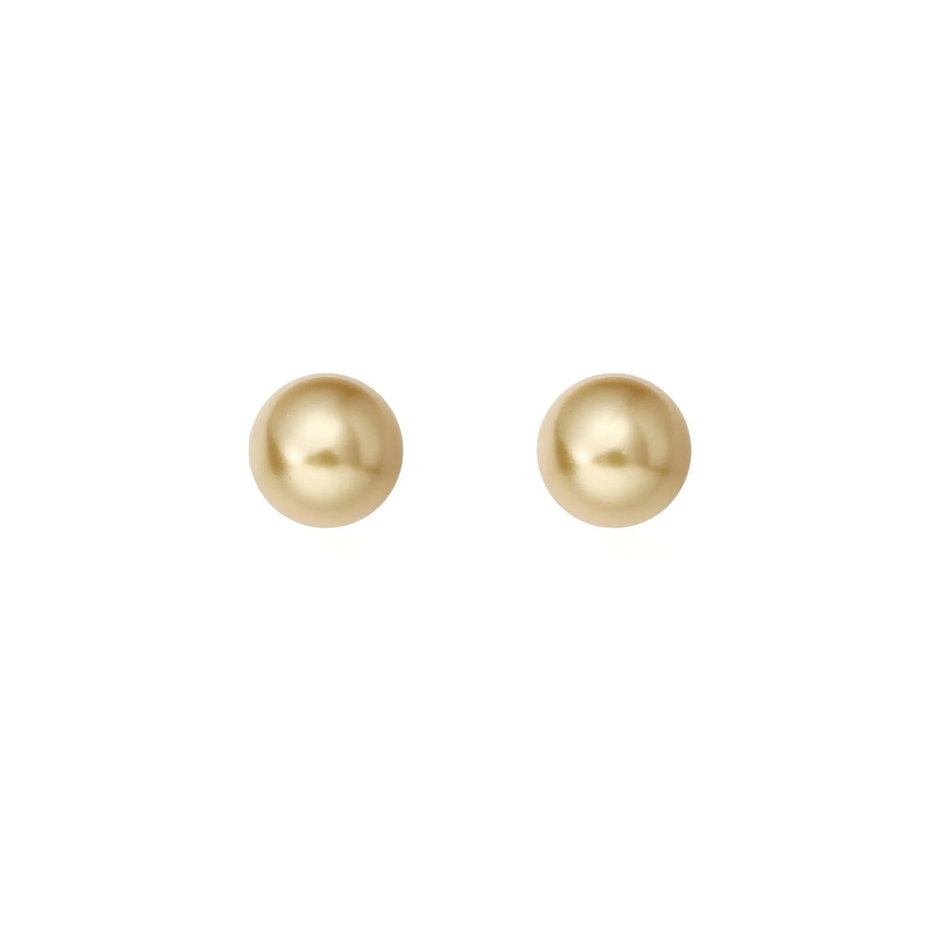 A pair of large geometric pearl stud earrings with a retro design on a silver setting.
