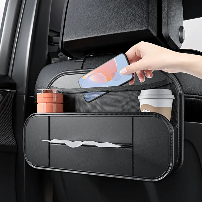 Black leather car seat storage bag with customisable compartments mounted on vehicle seatback