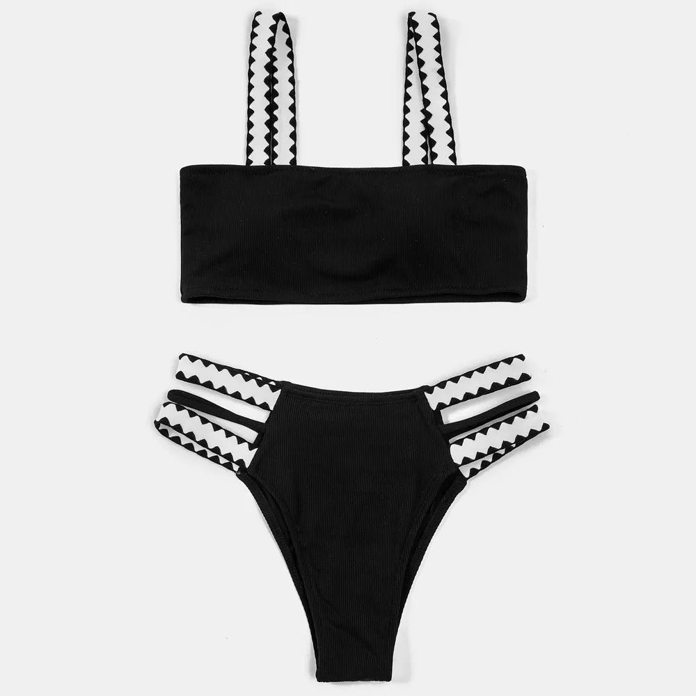 Black women's hollowed-out split swimsuit bikini set on mannequin