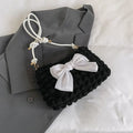 Women's canvas handbag with single shoulder strap showing horizontal square shape and sandwich pocket design