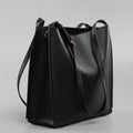 Brown genuine leather women's commuter bag with shoulder straps showing interior organisation compartments