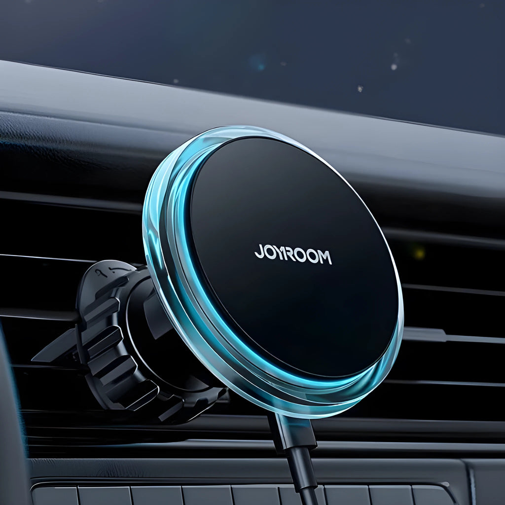 Black magnetic wireless car phone holder mounted on air vent with smartphone attached