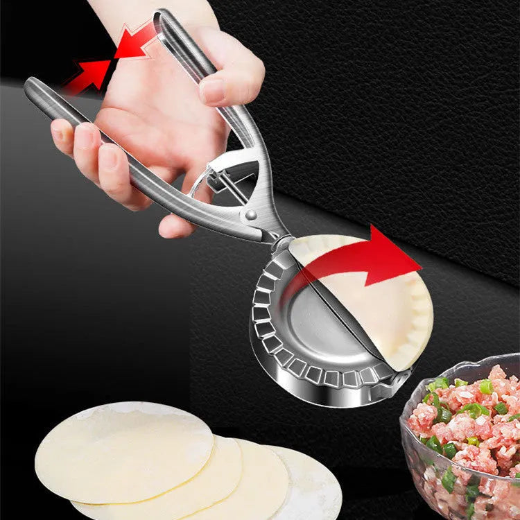 Silver stainless steel manual dumpling press tool on kitchen work surface