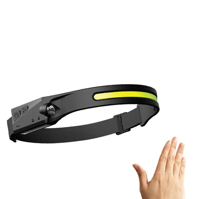 Black USB rechargeable headlamp with a wide COB LED lens and a side wave sensor on the headband.