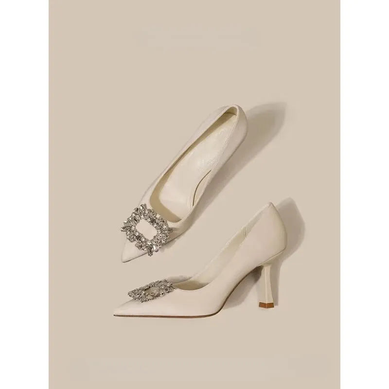 Women's pointed toe stiletto pumps in microfiber with a mid heel and rubber sole.
