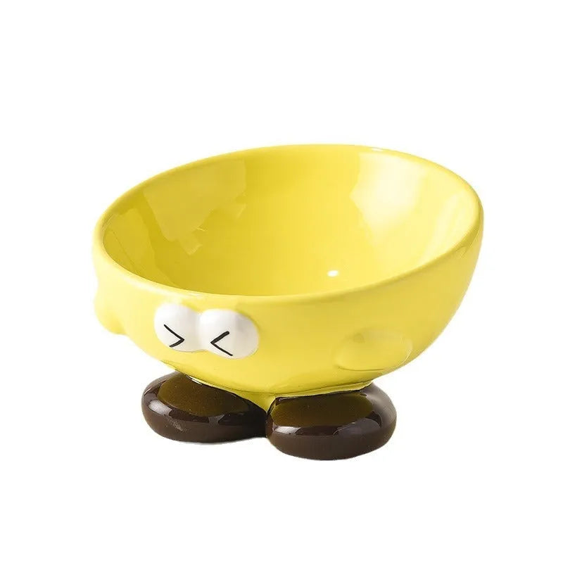 Blue ceramic pet bowl with tall, angled sides and a cute face design for cat or small dog feeding.