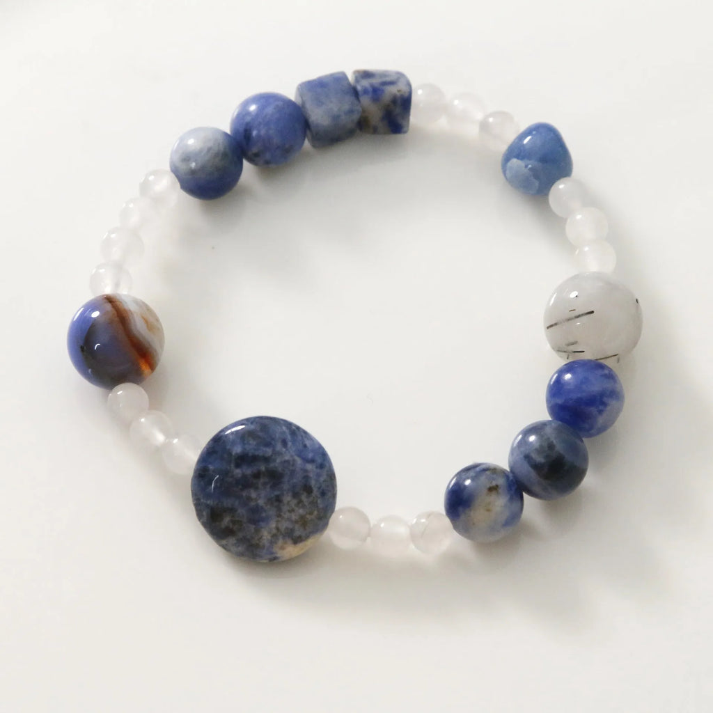 Hand-woven natural blue point stone and black hair crystal agate bracelet with geometric design