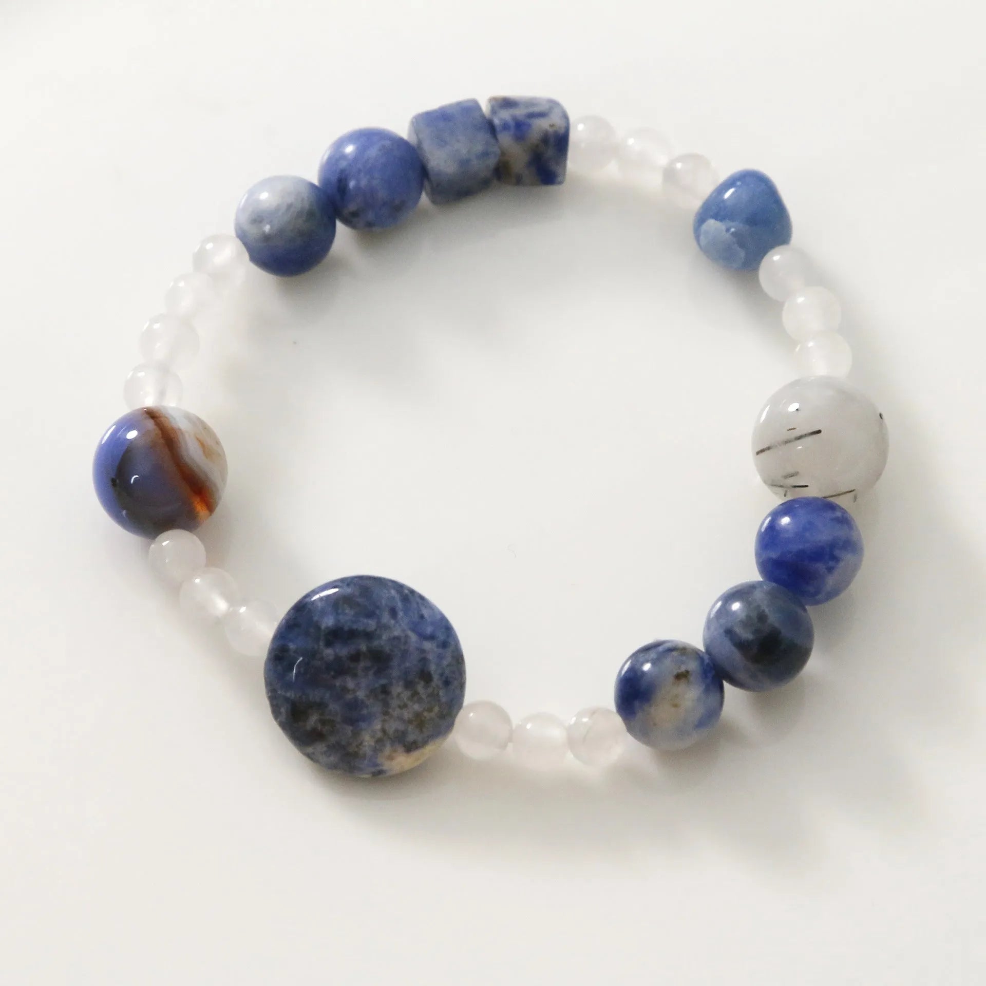 Hand-woven natural blue point stone and black hair crystal agate bracelet with geometric design