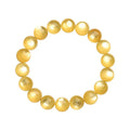 Yellow golden dragon mica bracelet with polished round geometric beads on wrist