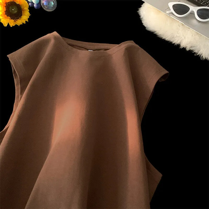 Men's loose fit cotton tank top in solid colours showing sleeveless design and straight hem