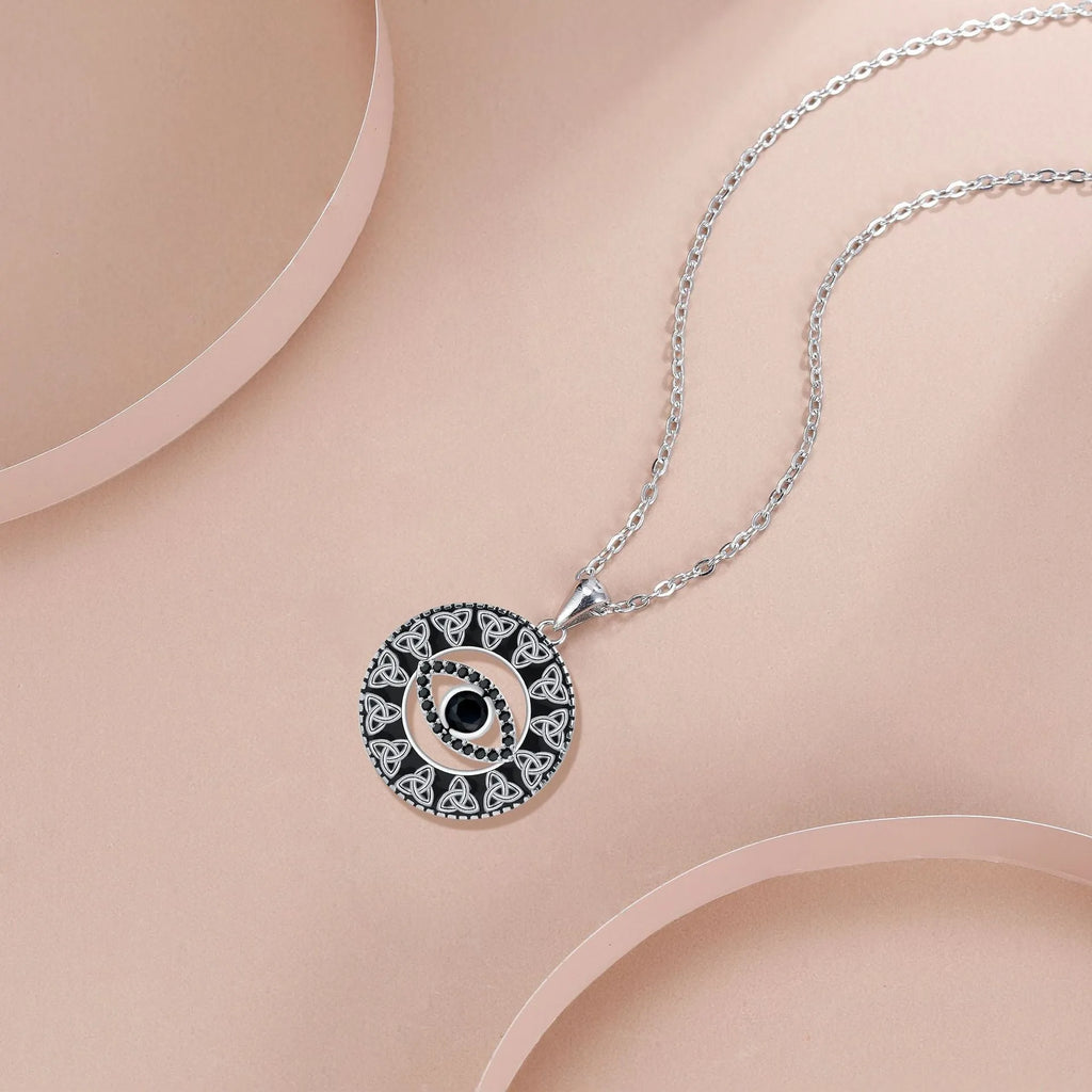 Copper devil's eye pendant necklace with a cross chain for women.