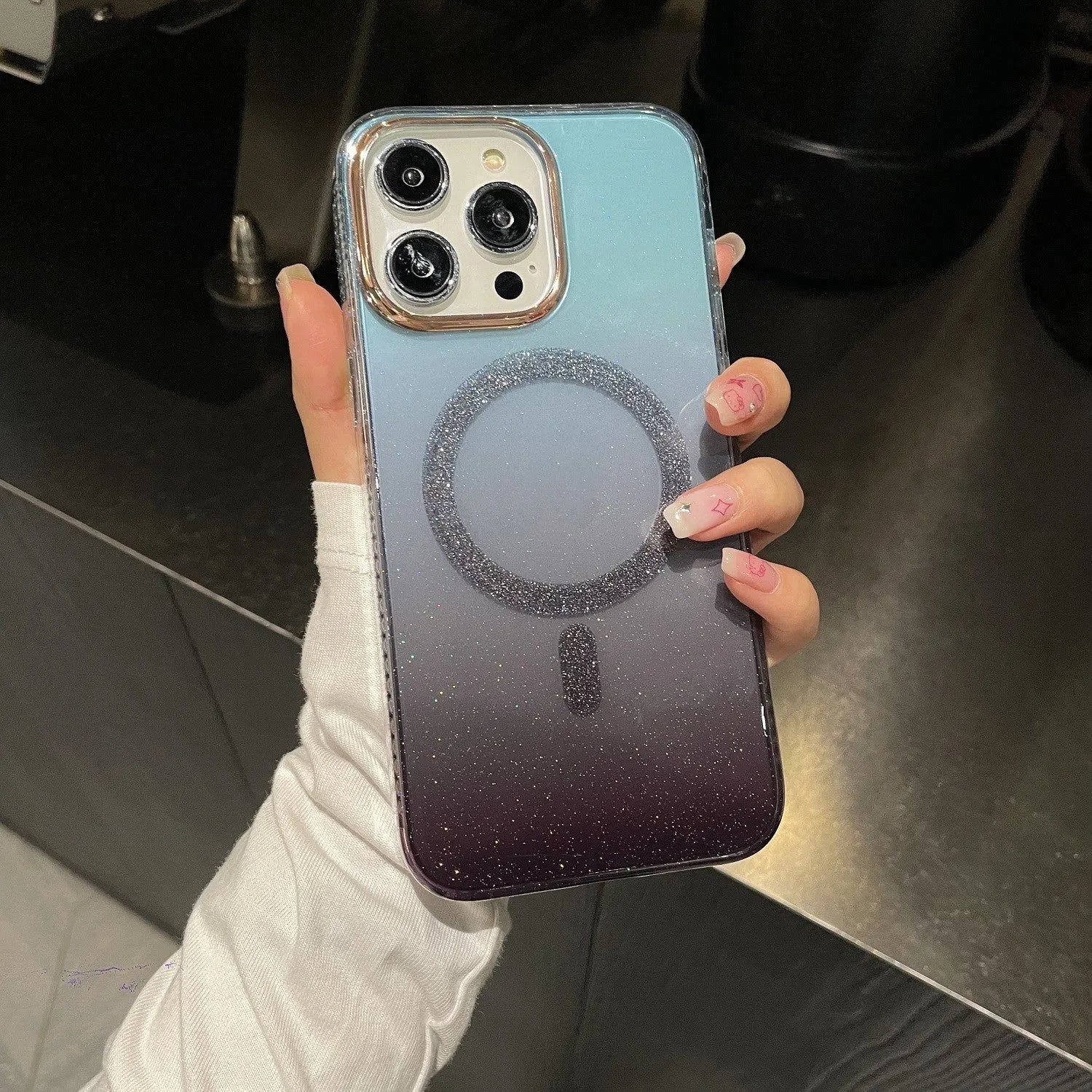 Magnetic suction phone case with gradient glitter finish and gold rim for iPhone in light purple colour