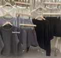 Women’s loose-fitting knitted set with long sleeve sweater and shorts in dark gray