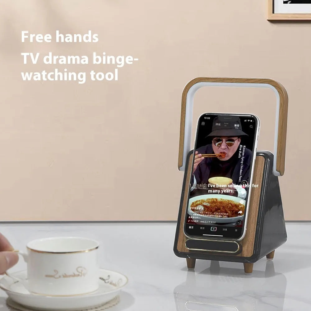 Wireless charging induction Bluetooth speaker small night lamp in Platinum Jazz finish on a wooden surface.