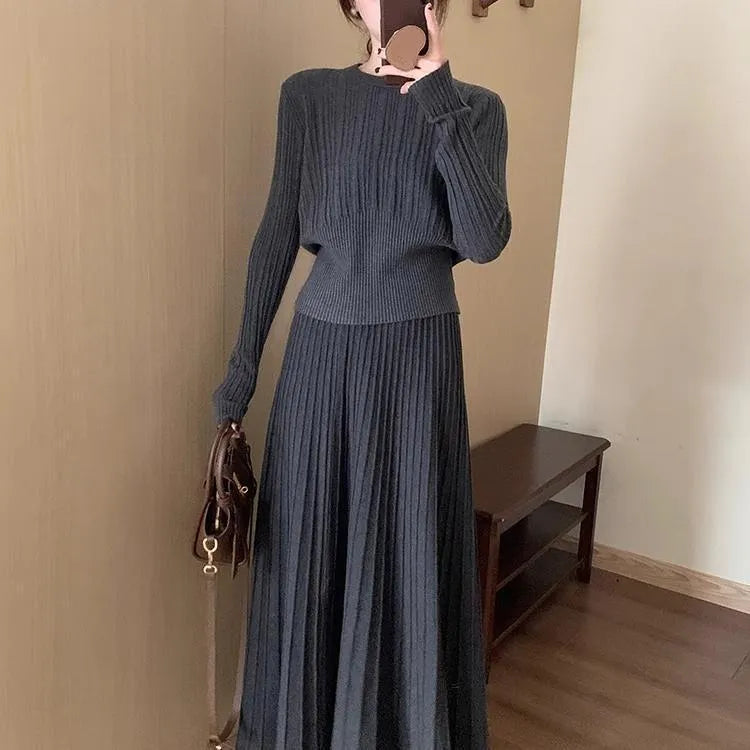Dark grey knitted two-piece dress suit with 3D texture, featuring a sweater and skirt in artistic retro style.
