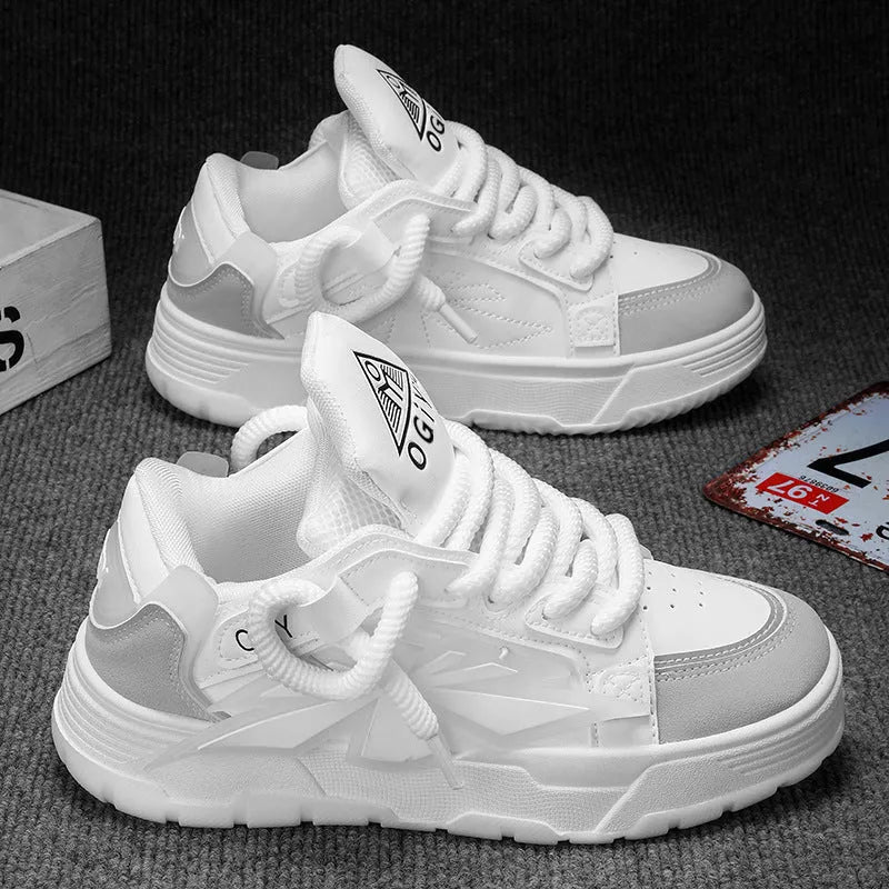Men's white chunky sneakers with thick rubber sole and synthetic leather upper on a casual background.