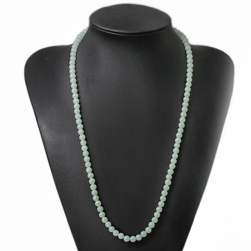 Adjustable natural jade bead necklace with 6.5mm round white and green beads on a long chain.