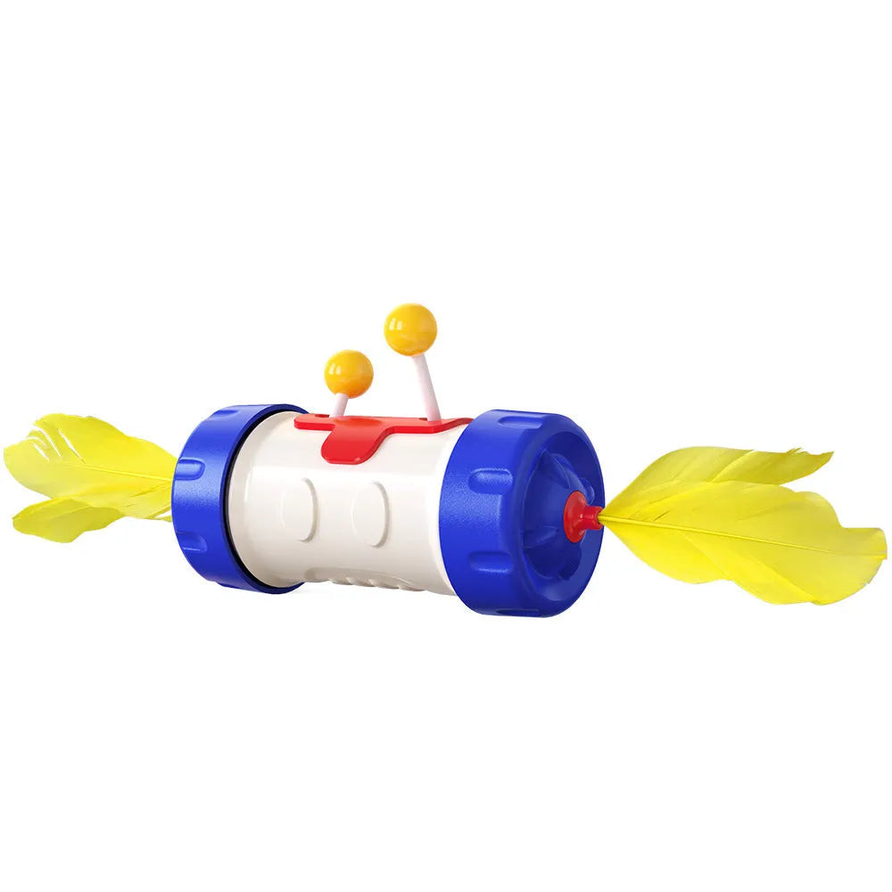Interactive cat stick toy with blue feather ball and wobbly yellow tumbler base on a carpet.