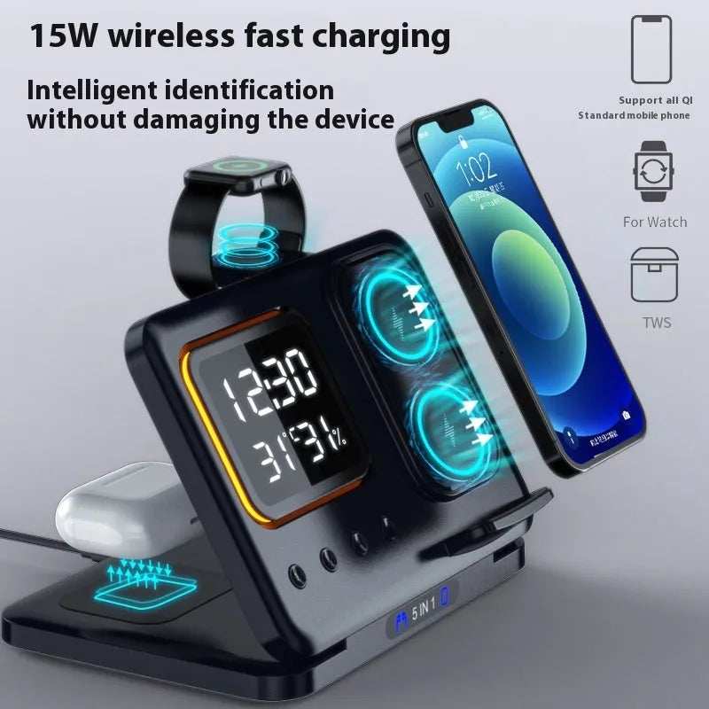 Black 5-in-1 wireless charging station displaying time and temperature, charging a phone and a smartwatch.
