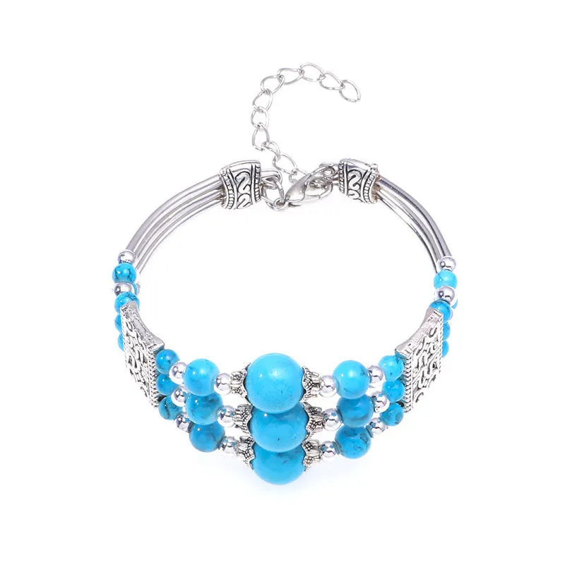 Tibetan style wide bangle bracelet with colourful beads, turquoise tone, tassel detail and electroplated alloy finish