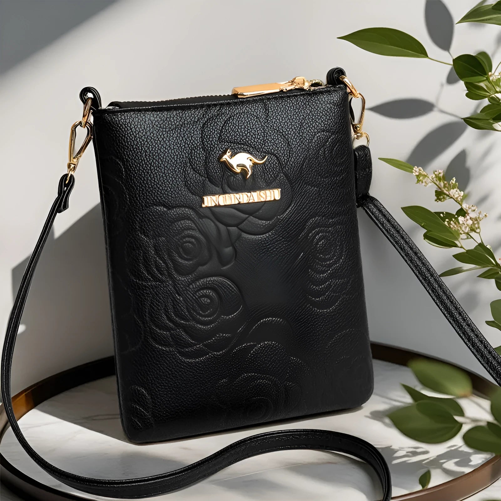 Soft black PU leather square vertical shoulder messenger bag with an external front pocket.