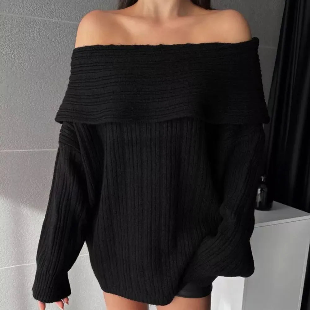 Women's loose long sleeve acrylic pullover sweater in white, shown laid flat.