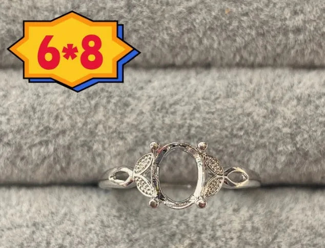Oval denier open mouth ring with 6x8mm stone and five-pointed star on electroplated copper band.