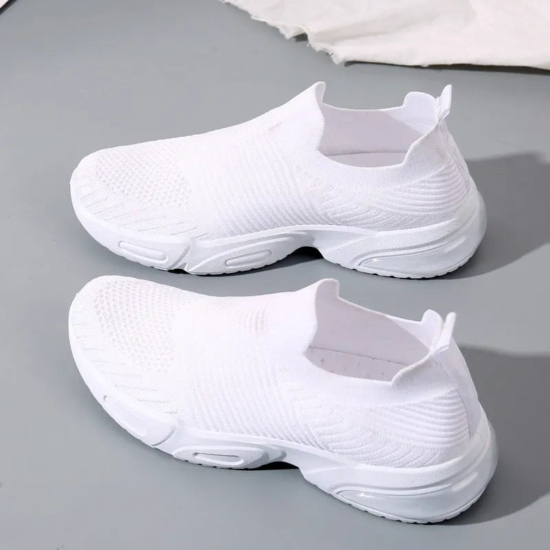 A pair of breathable mesh slip-on sock shoes with a PVC sole, shown in black colour.