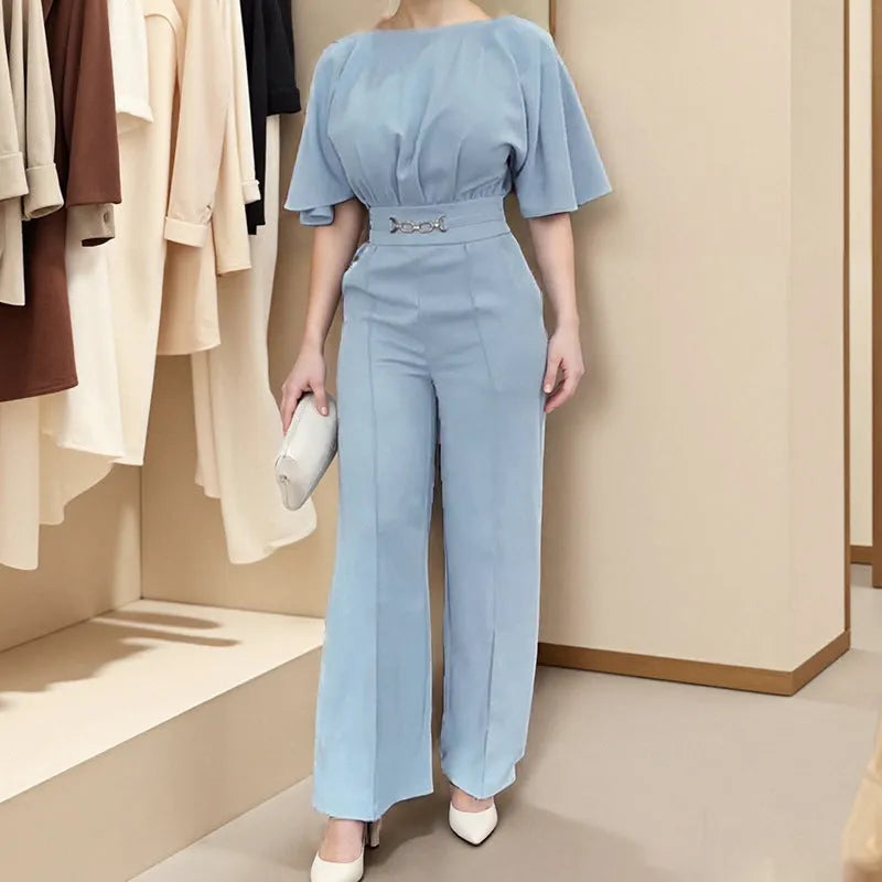 Blue polyester men's suit with long-sleeve jacket and trousers on a hanger.