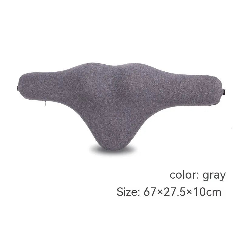 Dark grey memory foam car neck pillow on a car headrest.