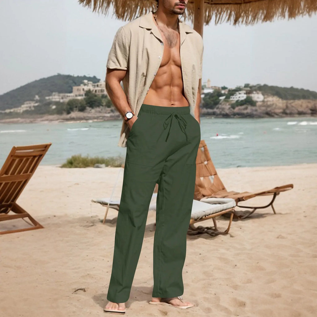 Men's beige cotton linen straight leg trousers with a drawstring elastic waistband laid flat.
