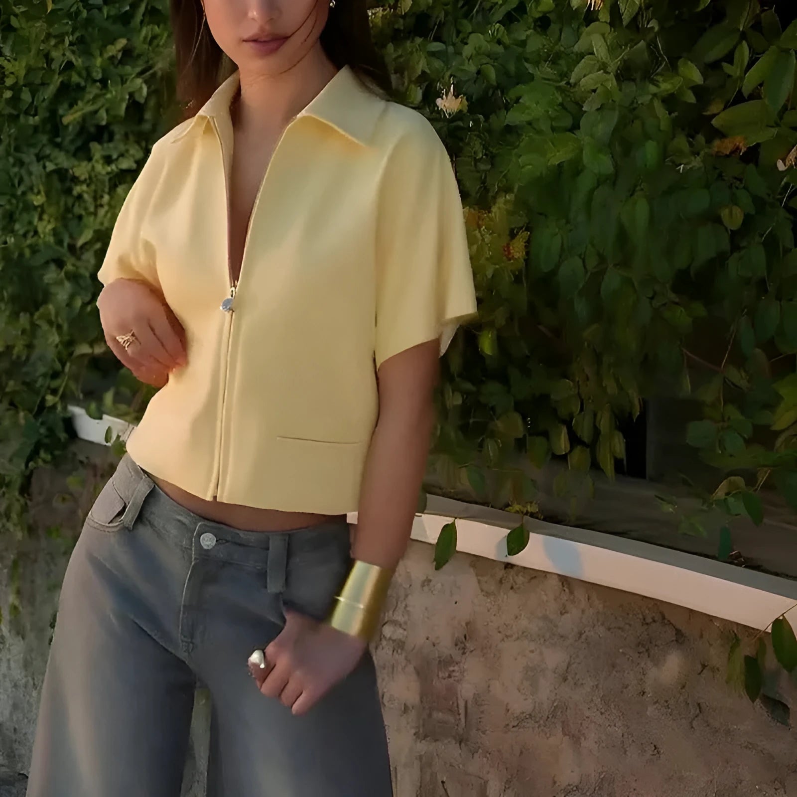 Man wearing a loose-fit yellow short-sleeve casual polyester shirt.