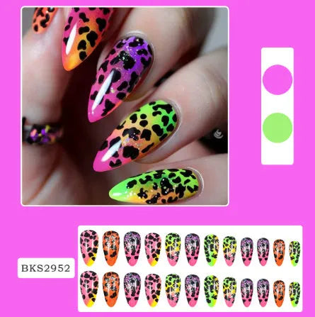 Set of four Wear Armour medium almond shaped frosted nail stickers showing French leaves, leopard print, macarons, and colourful plating designs.