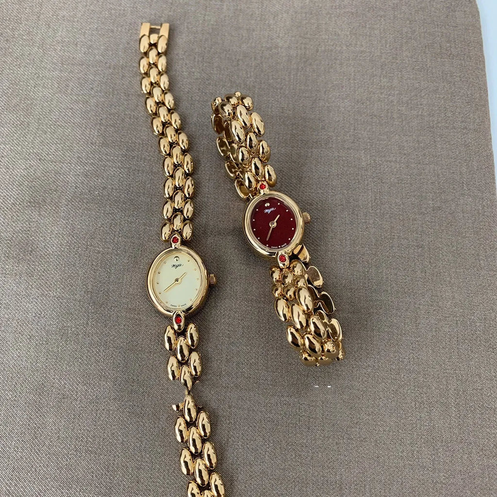 Retro oval small dial women's watch with gold alloy strap, shown in red dial and gold dial options