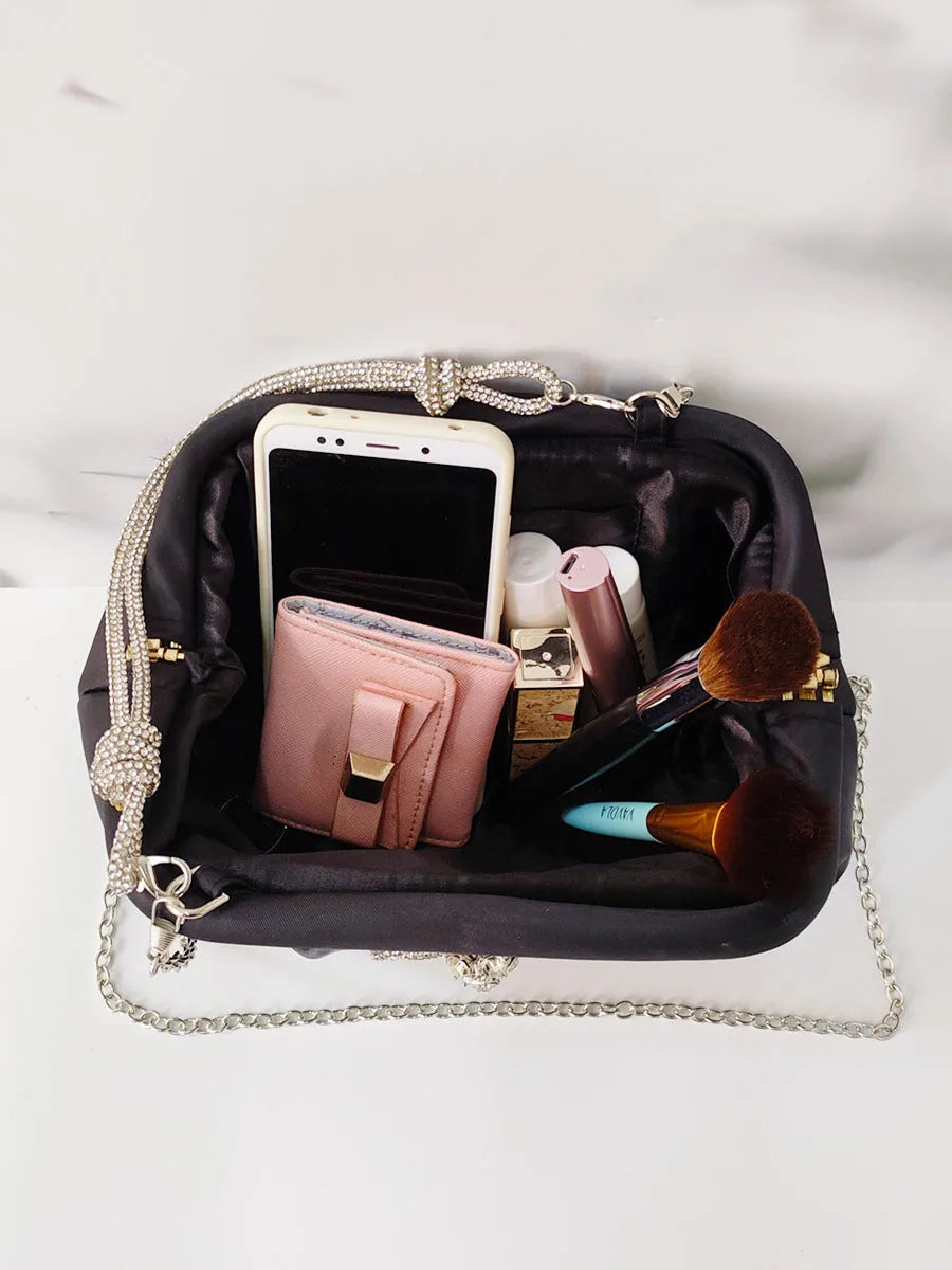 Women's soft polyester large-capacity shoulder messenger bag in shell shape with chain strap.