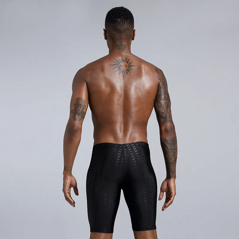 Men's solid colour swimming trunks in waterproof shark skin polyester fabric, shown in larger sizes.
