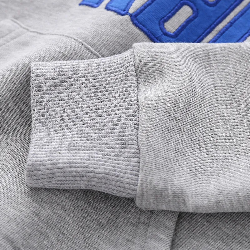 Casual boys cotton pullover sweatshirt with English print in navy blue on child model