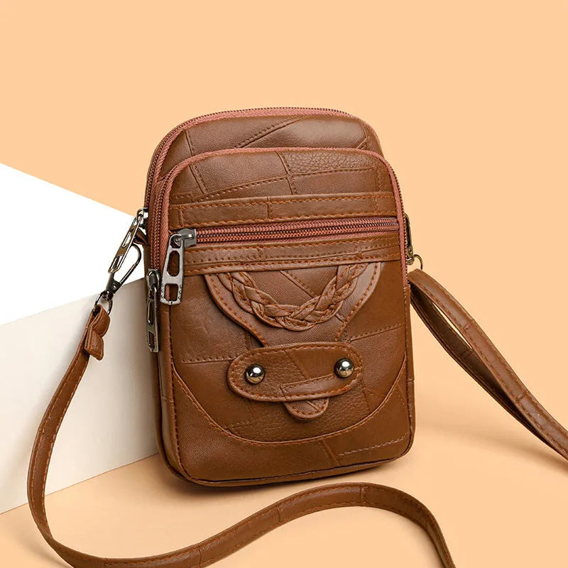 Retro style mobile phone bag in soft PU leather with weaving patterns and rivet detailing in four colour options