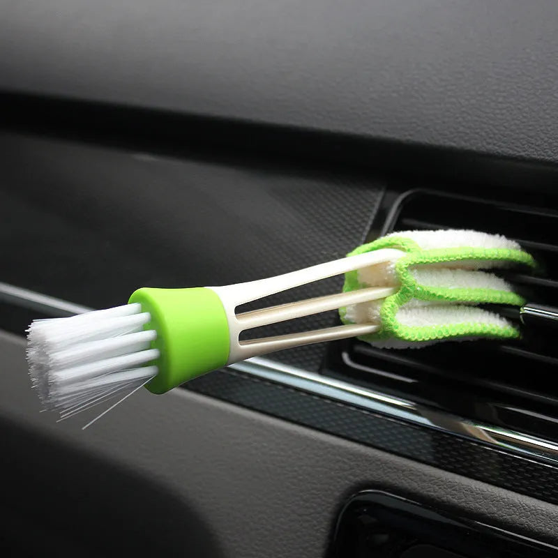 Multi functional double head gap brush for air conditioner slatted vent cleaning with green handle and superfine fibre bristles on white background