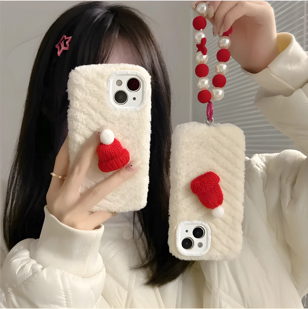 Red silicone phone case with plush Christmas hat bracelet for iPhone 14 Pro Max, back view
