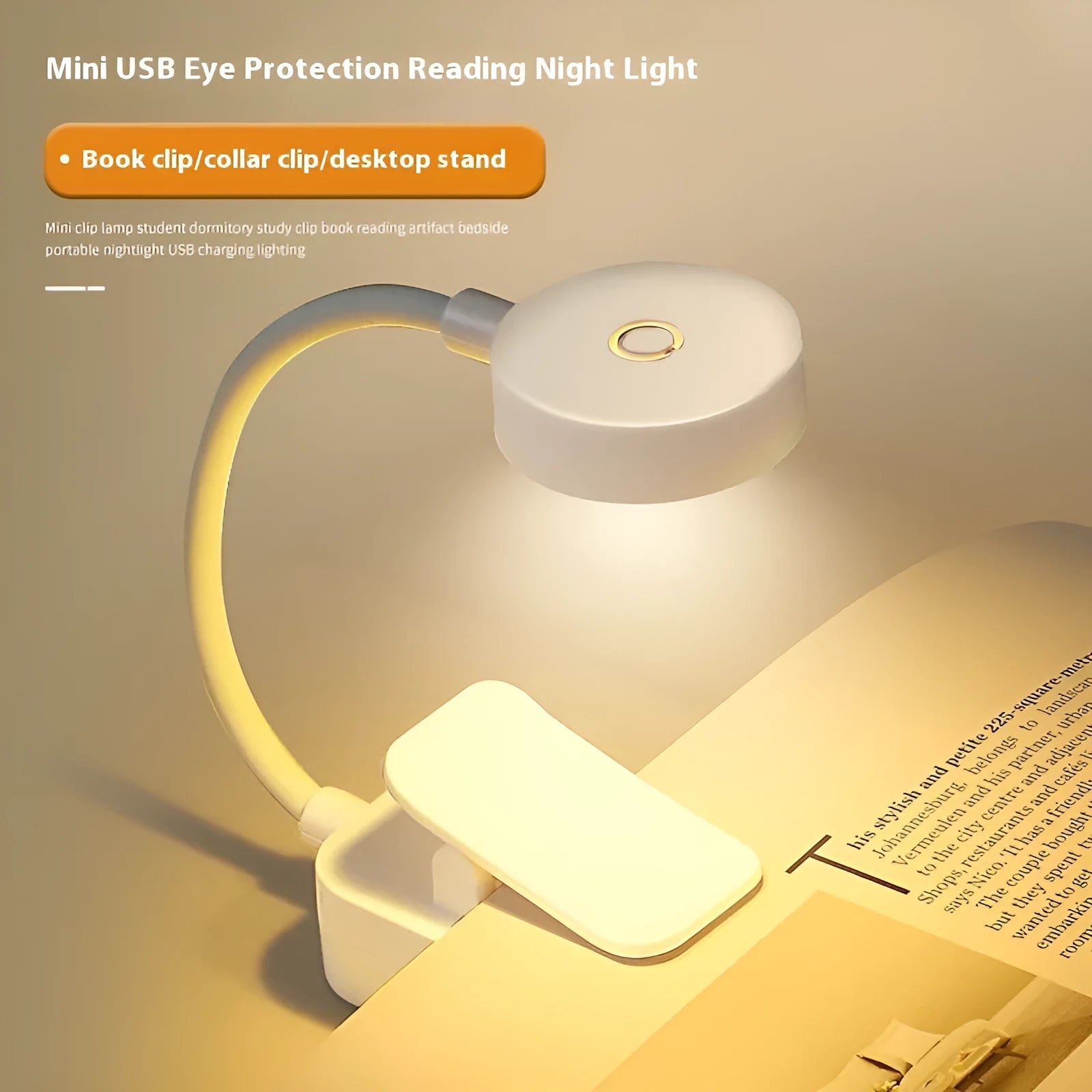White plastic rechargeable LED book clip light clipped onto a book with USB charging cable