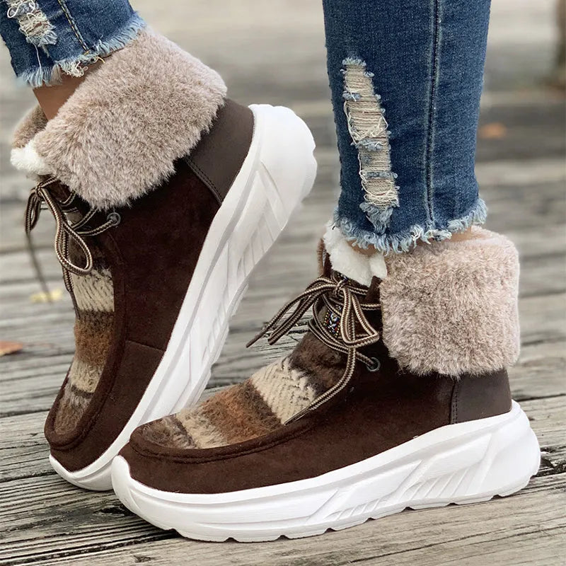 Beige women's lace-up suede snow boots with fuzzy finish and thick rubber sole.