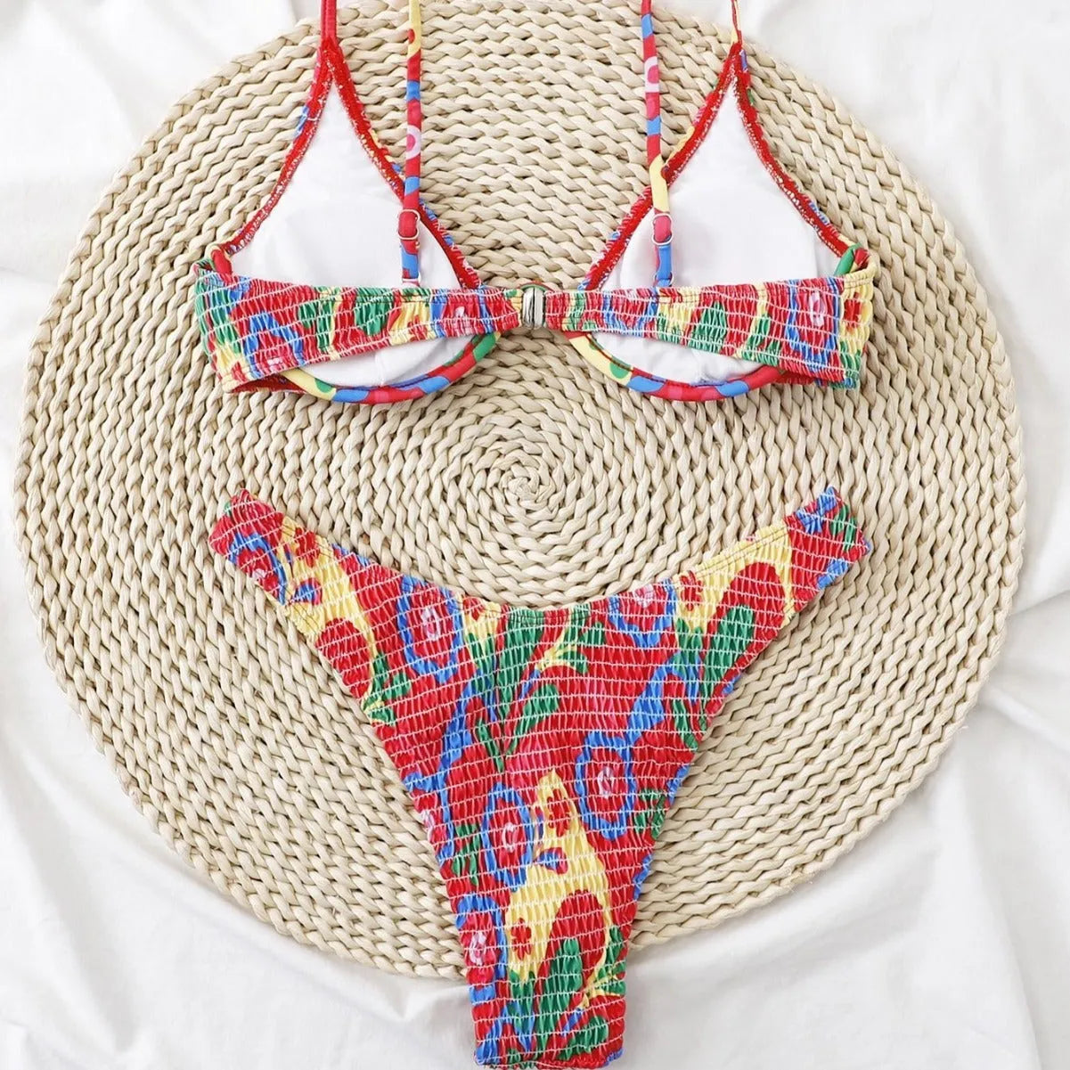 Red floral print women's underwire bikini top and briefs on a mannequin.