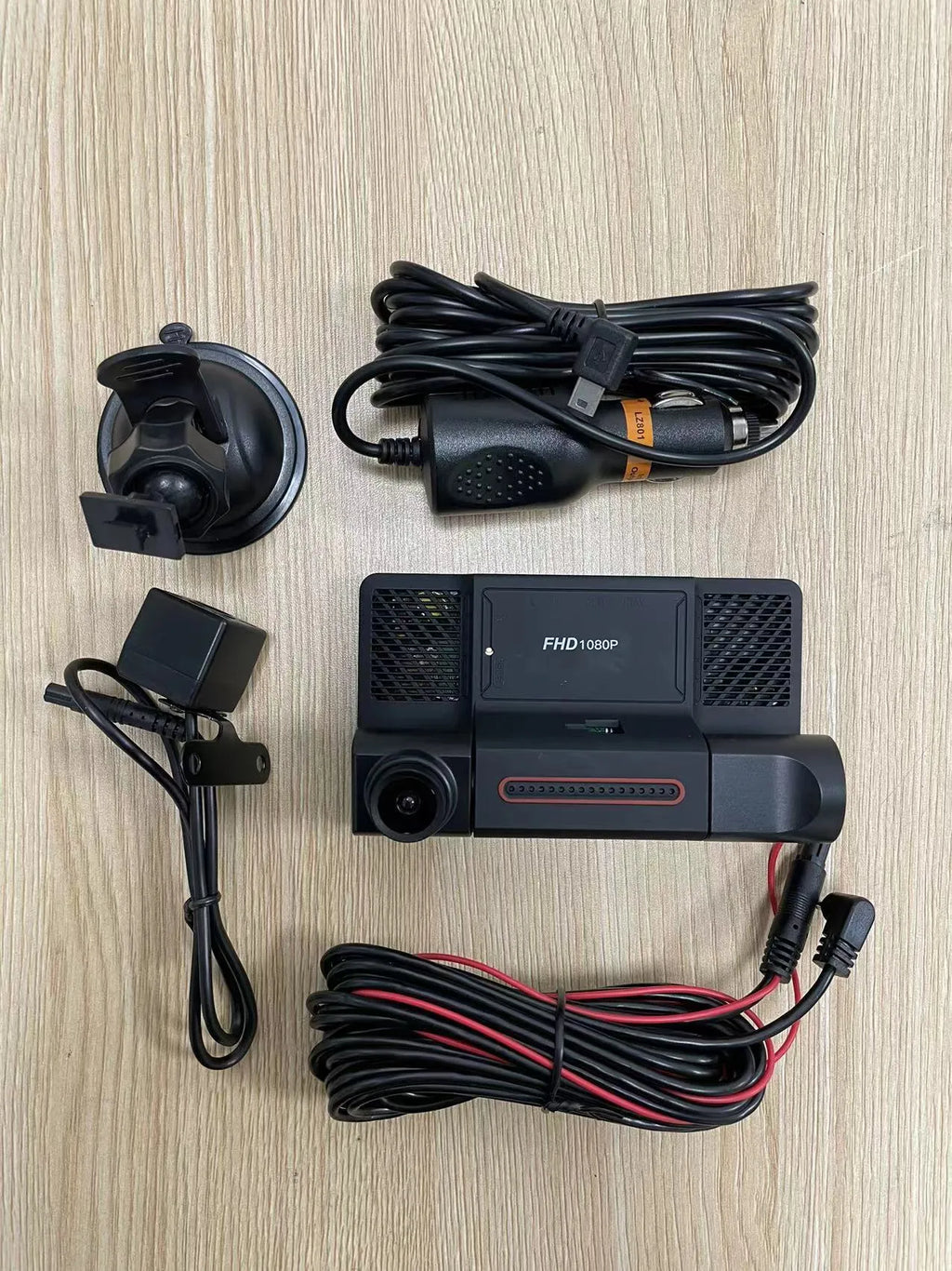 Black three lens dashcam with 4-inch touchscreen display for front, rear, and interior vehicle recording