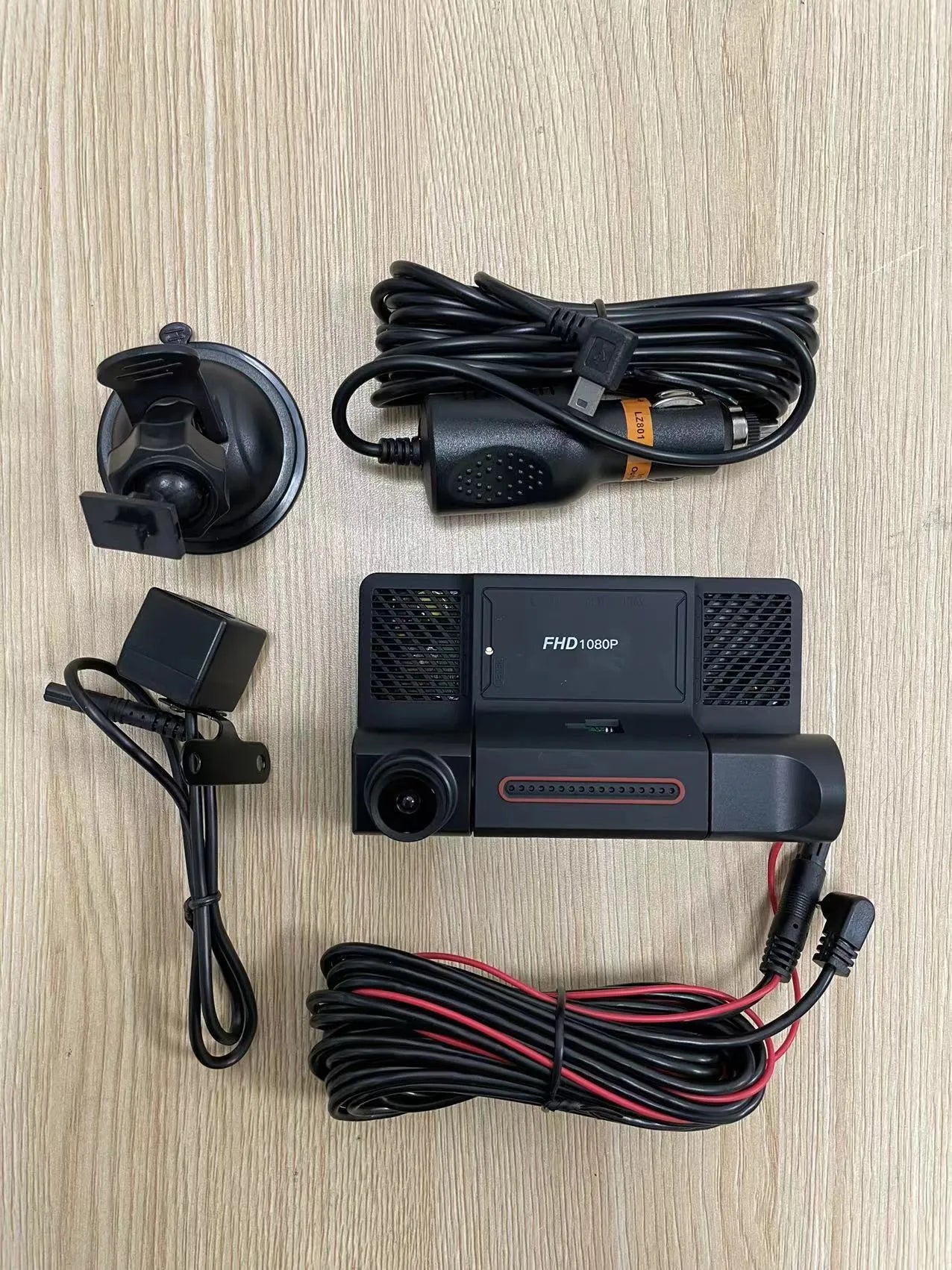 Black three lens dashcam with 4-inch touchscreen display for front, rear, and interior vehicle recording