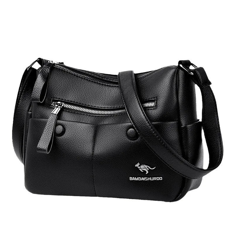 Soft black PU leather women's crossbody bag showing external pockets and a horizontal square shape.
